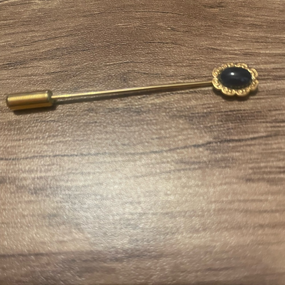 Black and gold hat pin